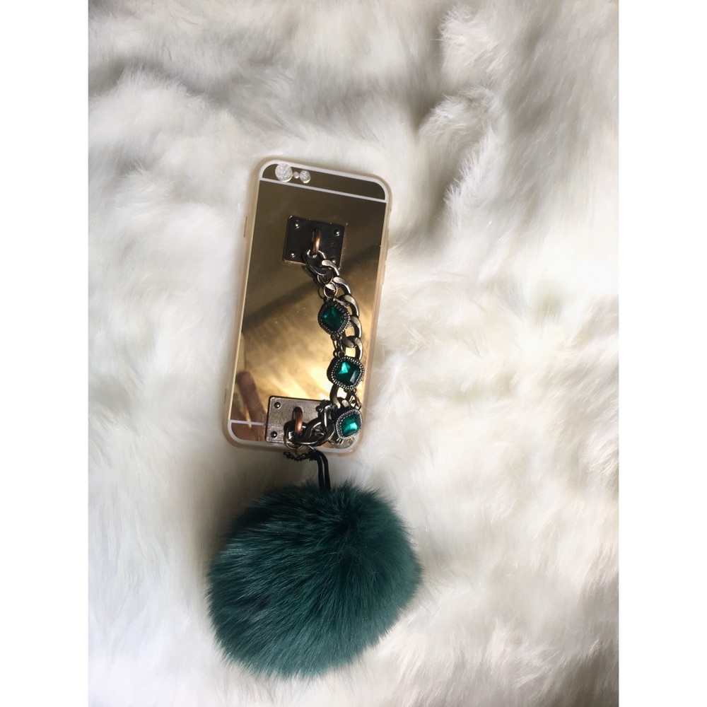 Gold iPhone mirror case with fur ball
